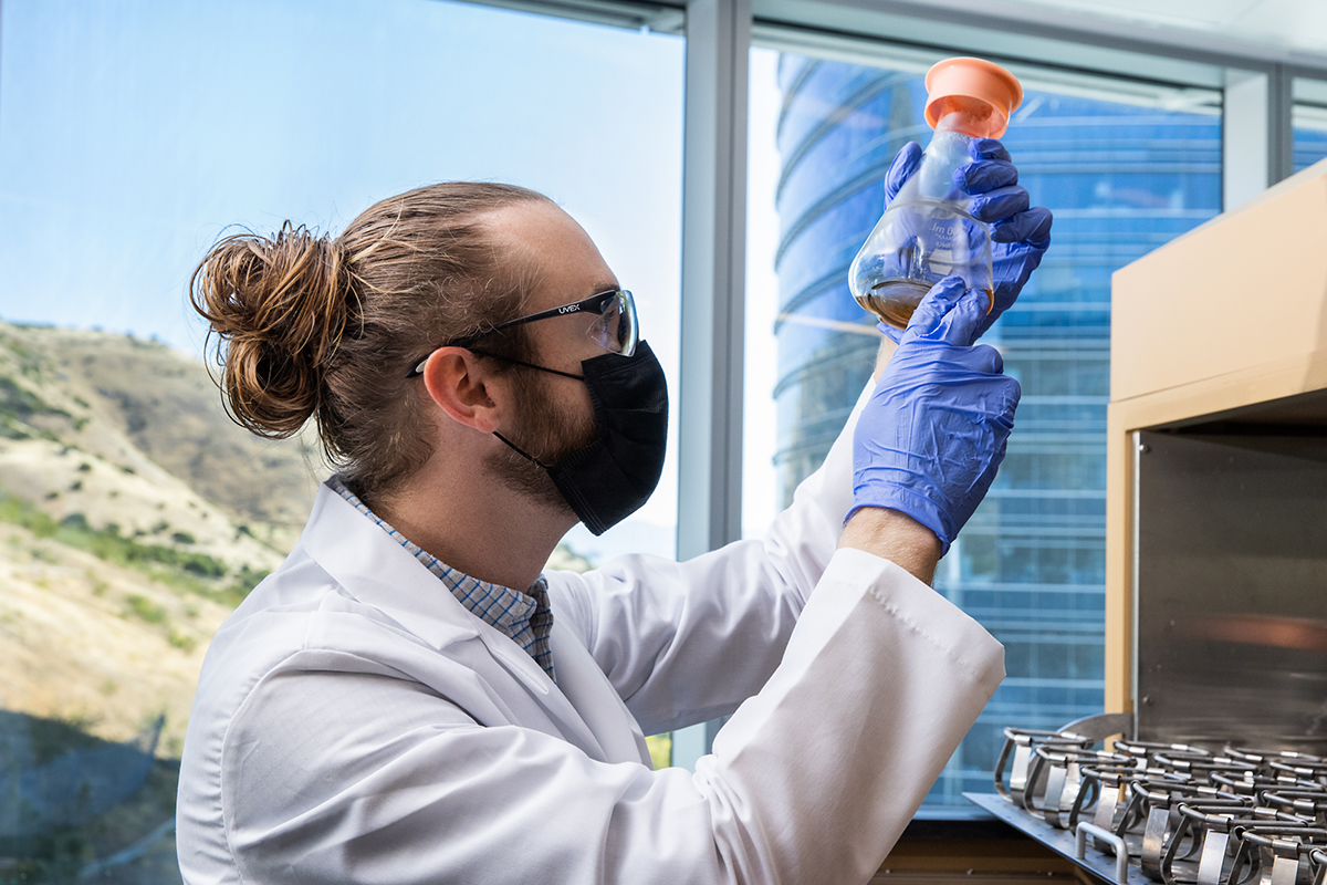 Scientist with beaker.